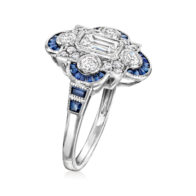 Platinum ring angle view: diamond center with blue sapphire side rows.