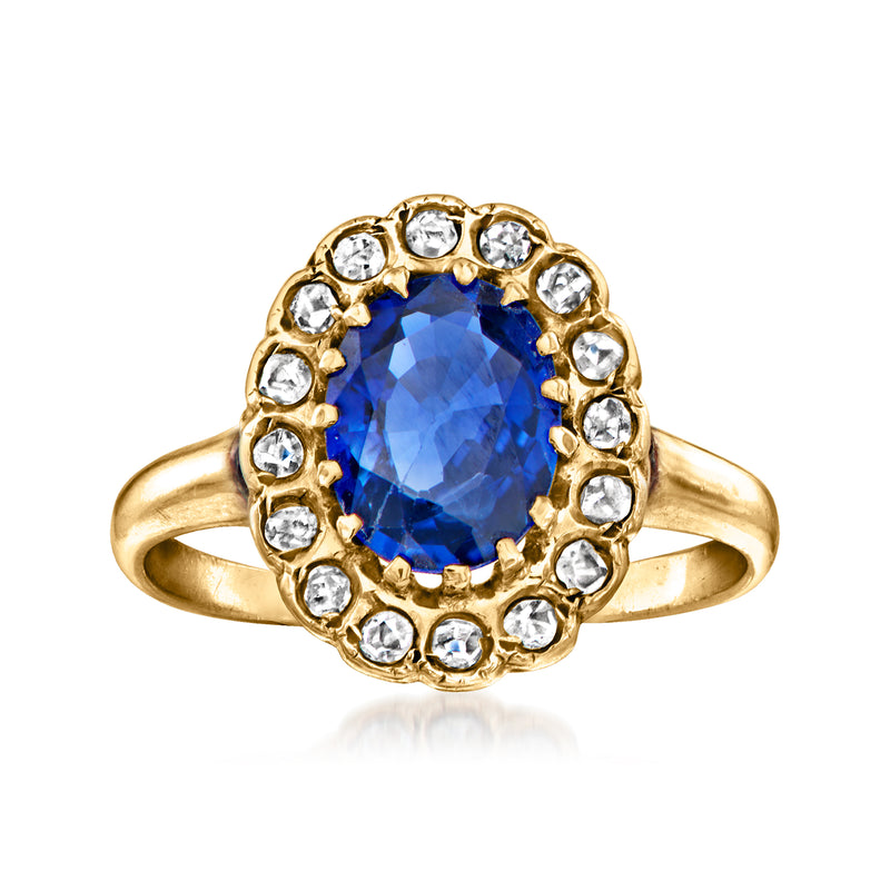 Vintage 14kt yellow gold ring with round blue sapphire and halo diamond accents