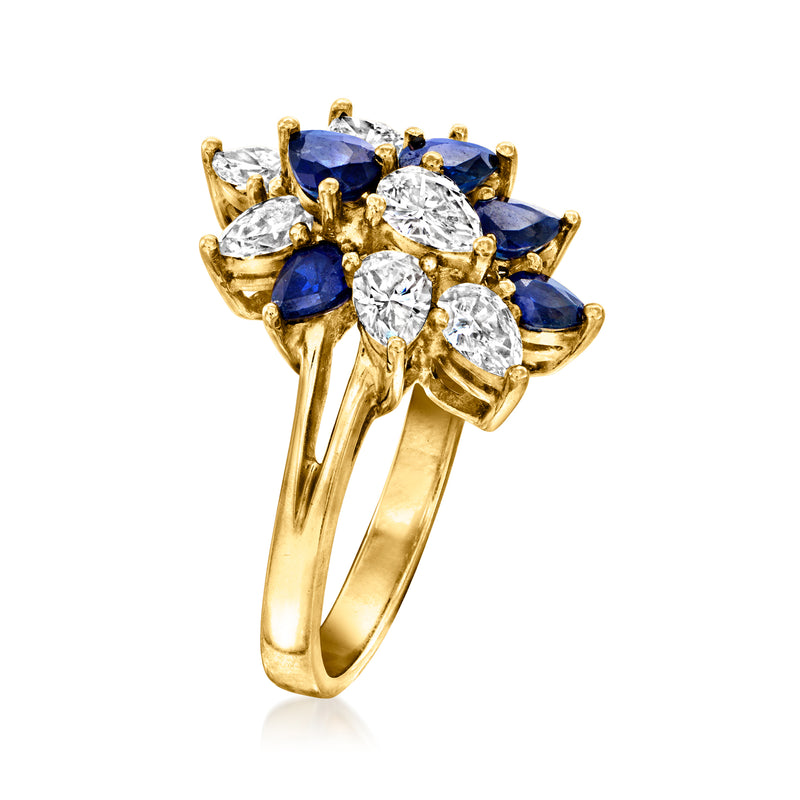 Yellow gold cluster ring with dark blue marquise stones and round diamonds