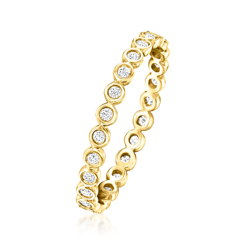 14k yellow gold eternity band side view with round diamonds in bezel settings