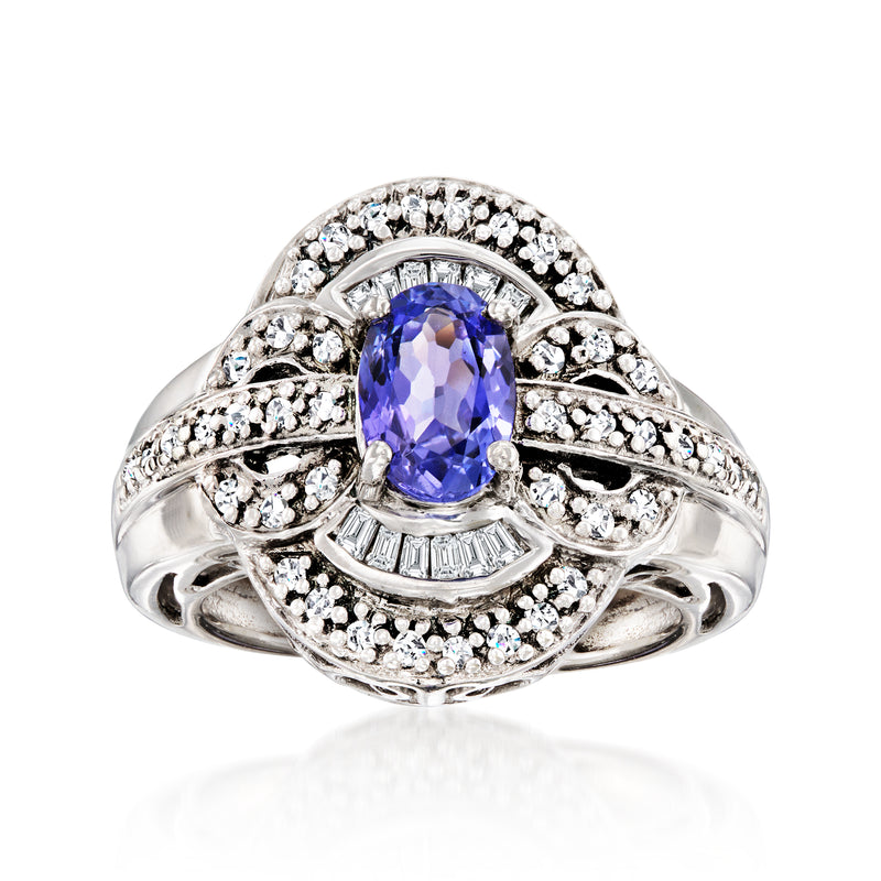 Vintage white gold ring with oval tanzanite center, diamond halo, split shank
