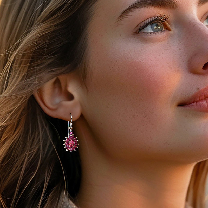Pink flower drop earrings on ear, sterling silver earwire with faceted stone cluster