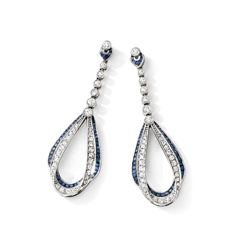 Sapphire and diamond teardrop drop earrings with haloed blue accents, 14kt white gold