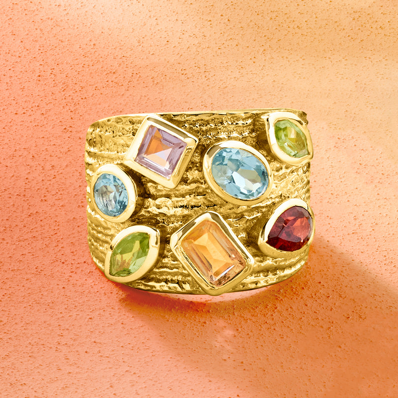 Gold over sterling multi-gem ring, top view with light blue oval, purple, yellow, green, and red stones