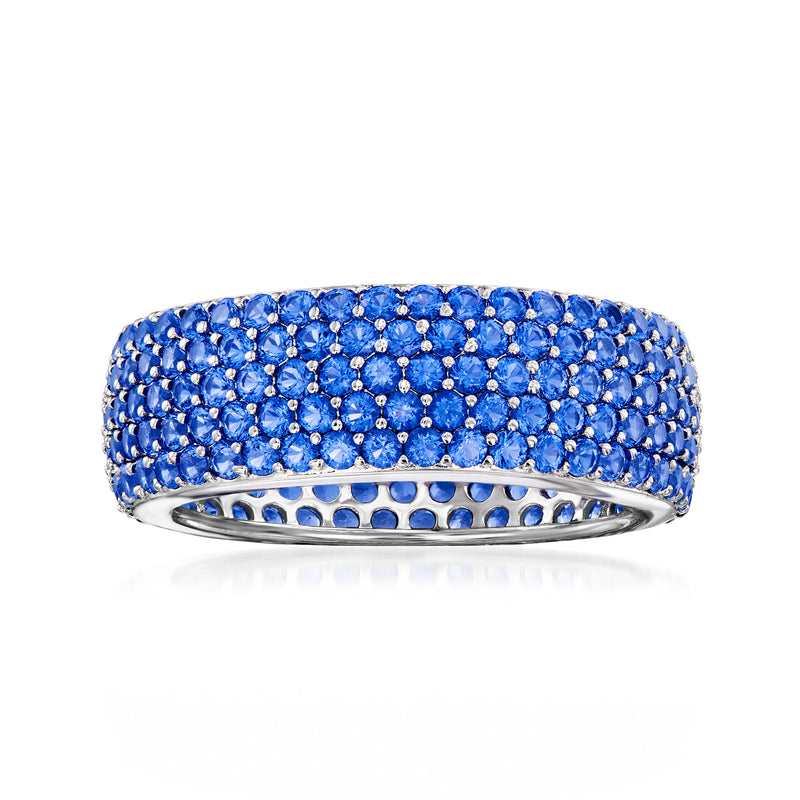 Sterling silver multi-row eternity band with blue simulated sapphire stones, round-cut.
