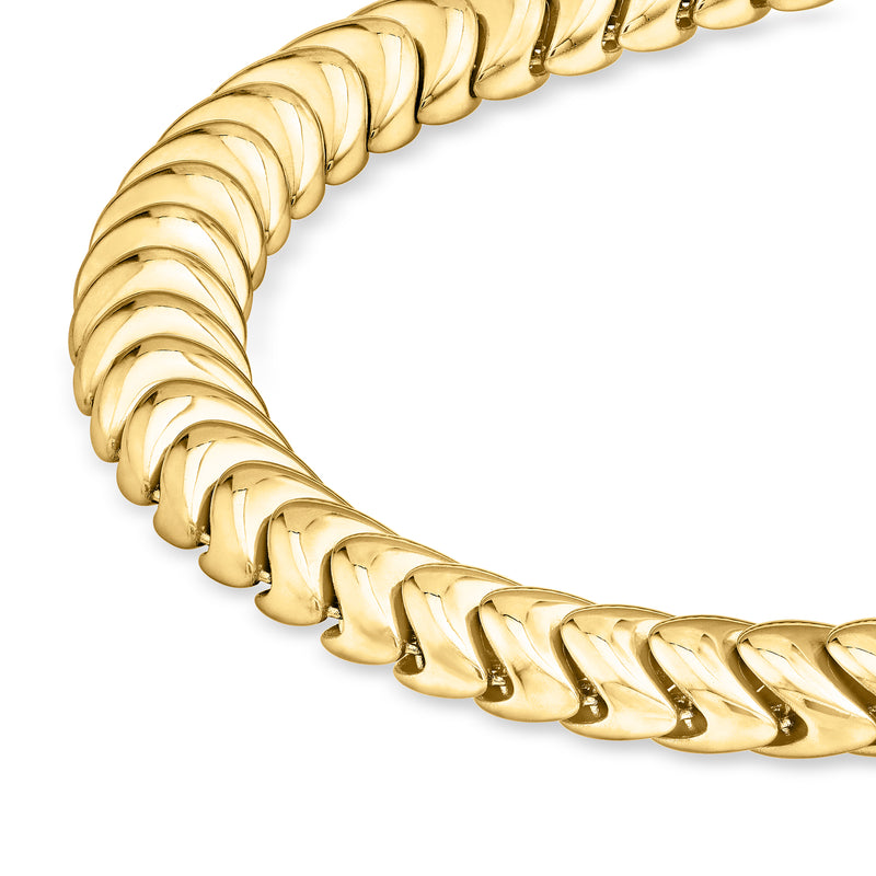 Close-up of yellow gold caterpillar-style bracelet links
