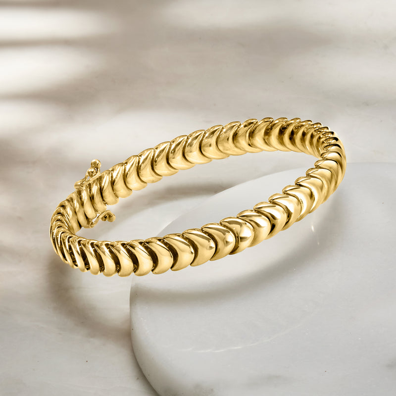 Yellow gold caterpillar-link bracelet angled view with clasp detail