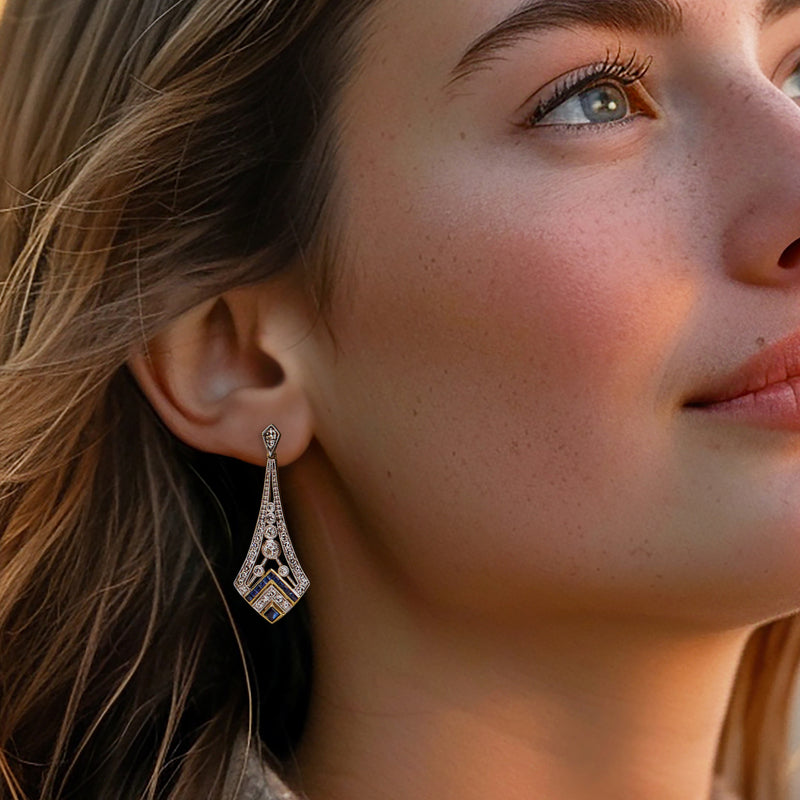 Vintage 14kt yellow gold drop earring with diamond and sapphire geometric design.