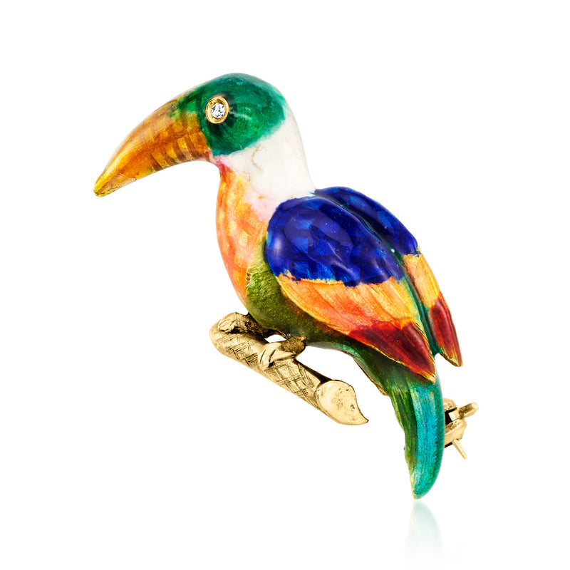 Multicolored enamel toucan bird pin with a single diamond set in gold