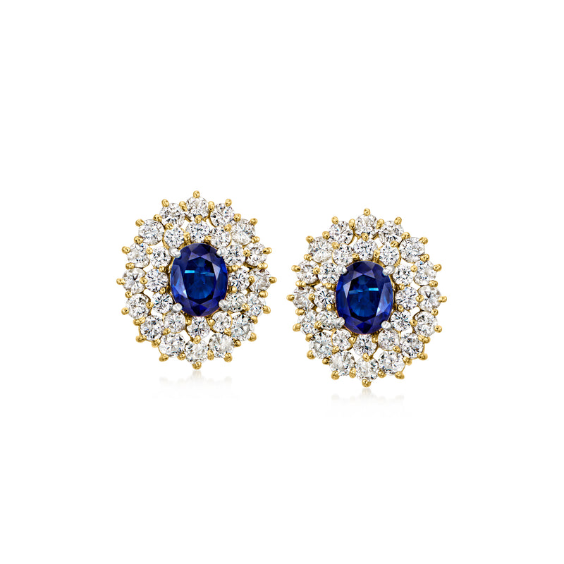 18kt yellow gold sapphire & diamond cluster stud earrings, oval blue center