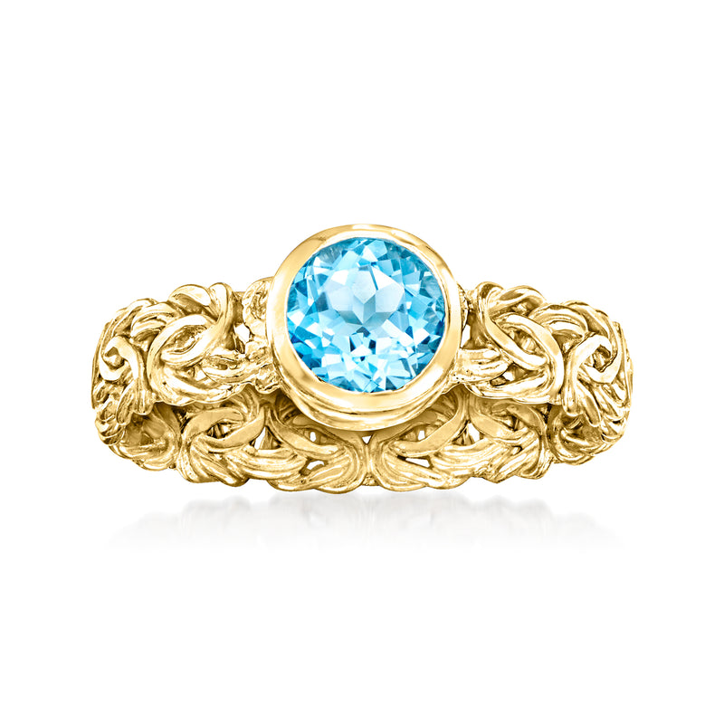 Gold Byzantine ring with bezel-set Swiss blue topaz center gemstone