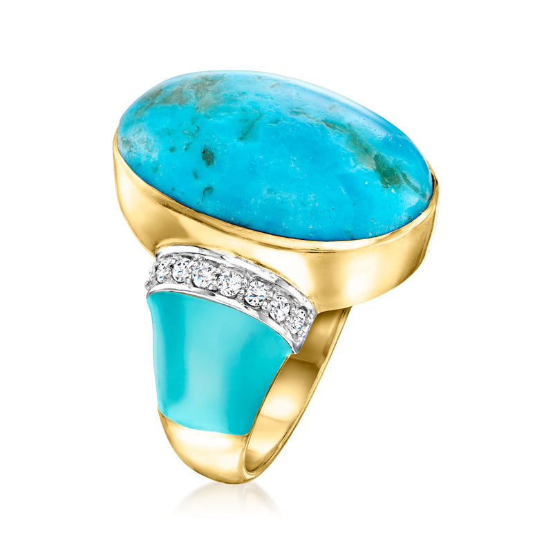 Gold-tone ring with oval turquoise cabochon and row of clear diamond-style stones