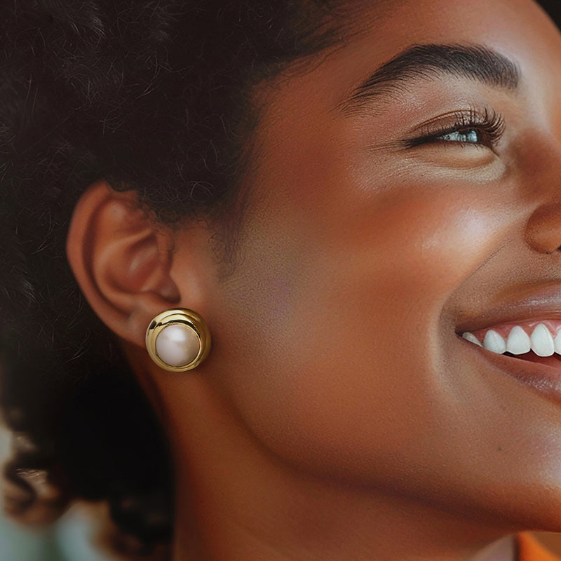 Yellow gold pearl stud earrings on side profile, white cultured pearl