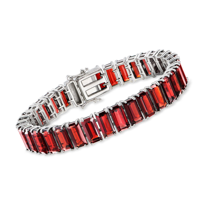 Sterling silver tennis bracelet with emerald-cut red garnet stones