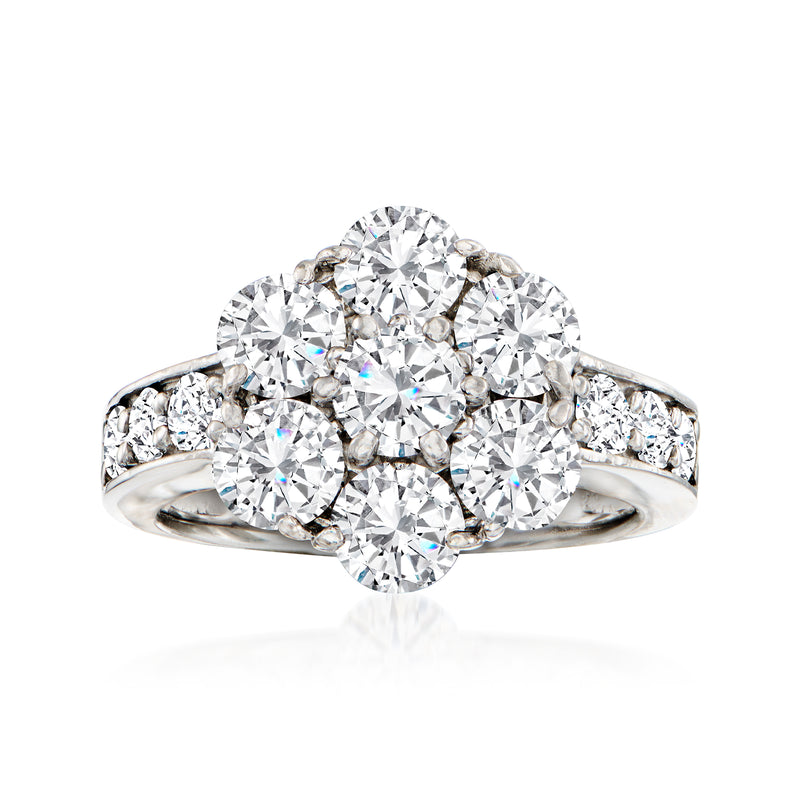 Platinum diamond cluster ring with round center stone and side diamonds