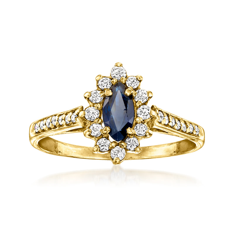 Vintage yellow gold ring with oval blue sapphire center and diamond halo