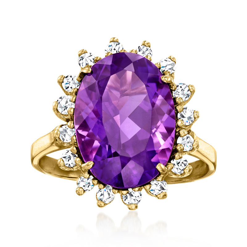 14kt yellow gold ring with oval amethyst center and diamond halo cluster