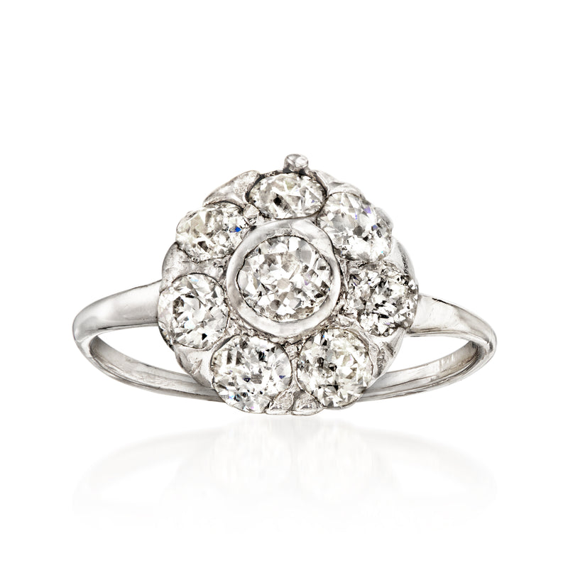 Vintage diamond flower ring in 14kt white gold, round center with halo of small diamonds