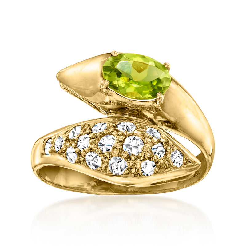 18kt yellow gold bypass ring with green oval peridot and round diamond halo