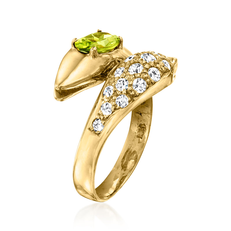 18kt yellow gold bypass ring with oval green peridot and round diamond cluster