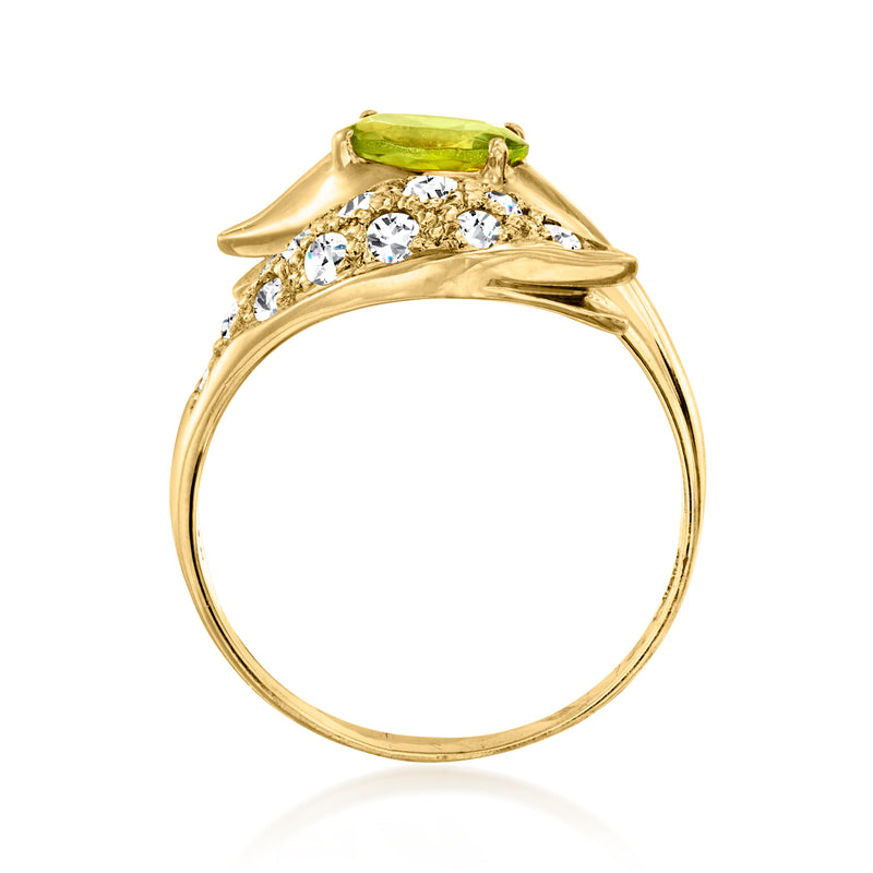 Yellow gold bypass ring with green peridot center and round diamonds across band