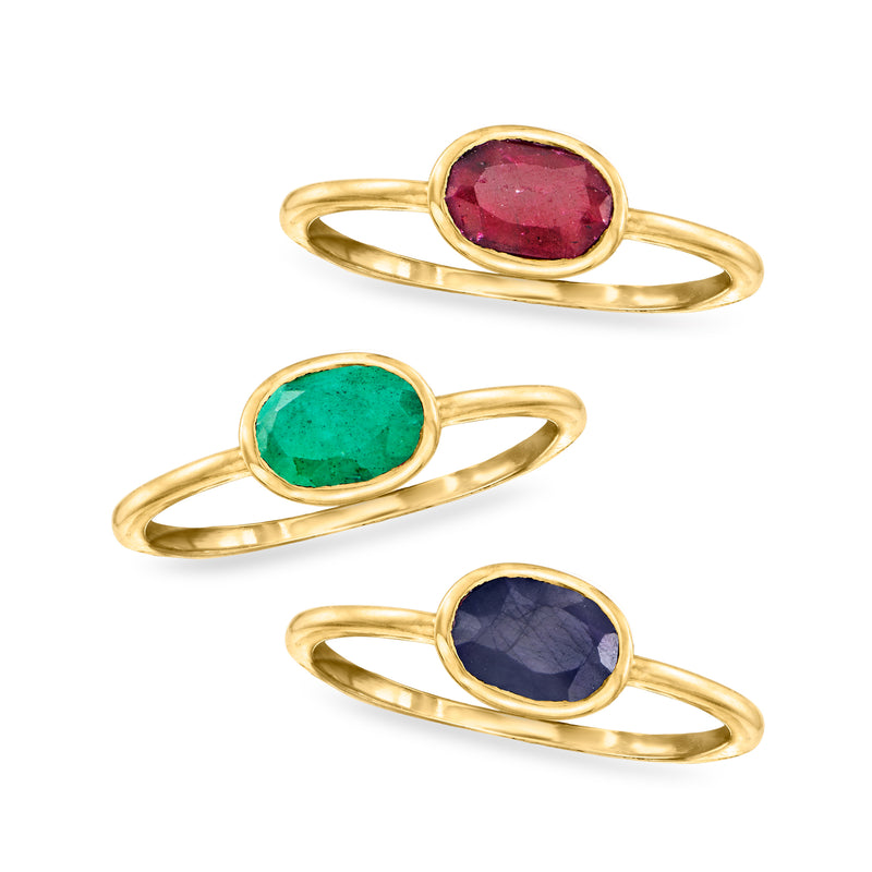 Oval gemstone rings: red on top, green middle, blue bottom; gold-tone bands