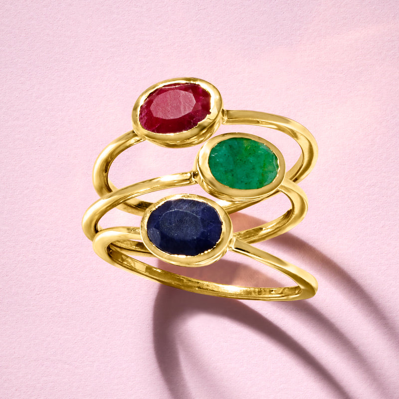 Stacking three-ring set in gold-tone with oval red, green, and dark blue stones