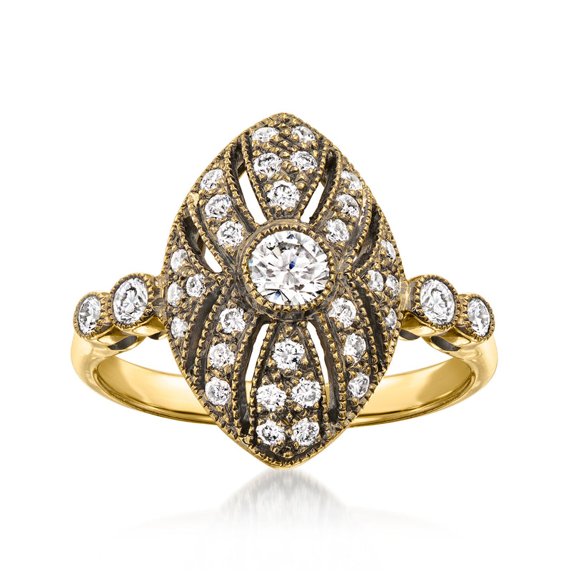 Vintage 18kt yellow gold diamond cluster ring with round center stone and halo