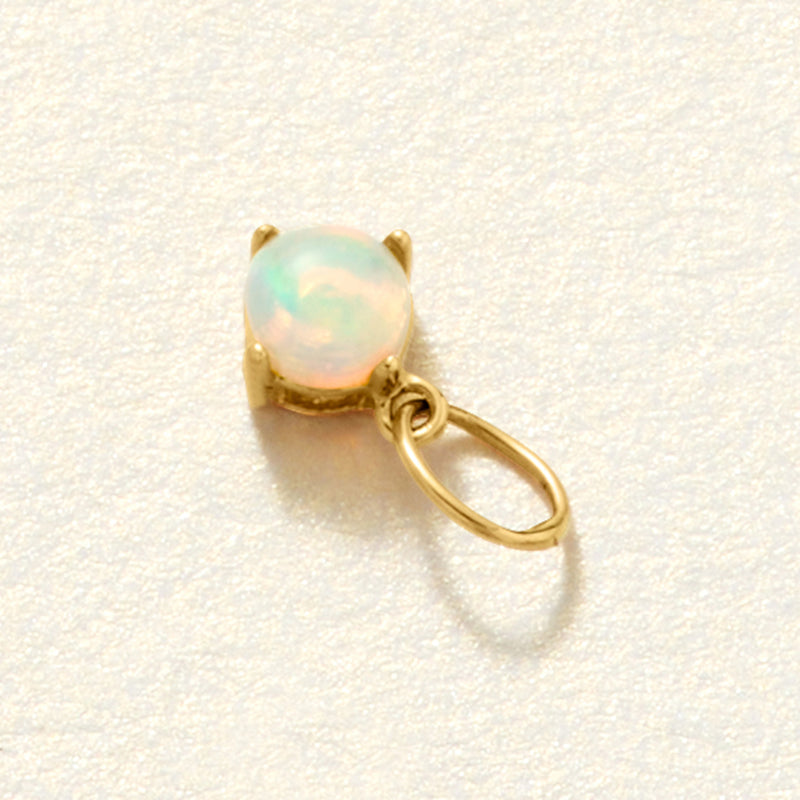 14kt yellow gold birthstone charm pendant with round opal-like greenish gemstone