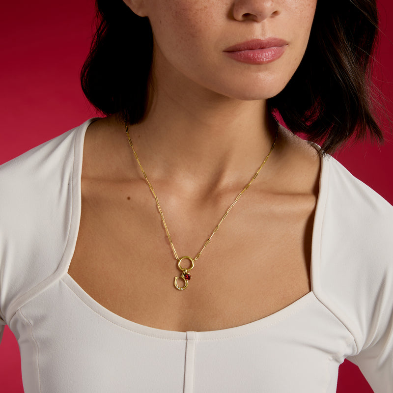14kt yellow gold birthstone charm necklace with small red and green gemstone pendants
