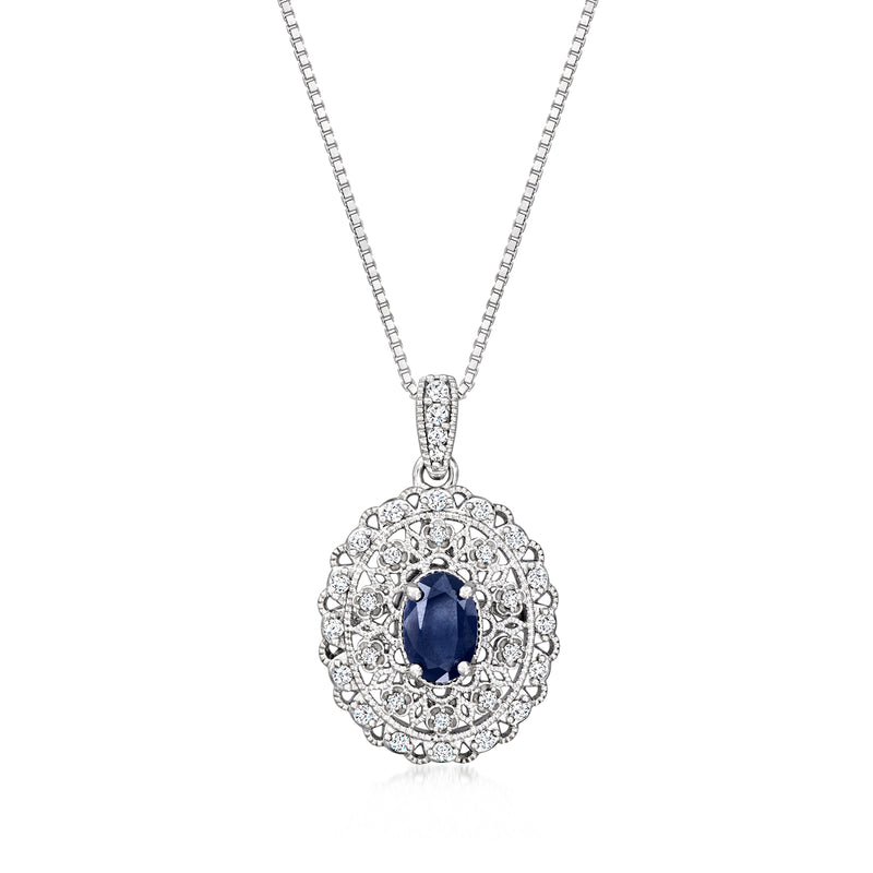 Sterling silver vintage pendant necklace with oval blue sapphire and diamond halo, on chain