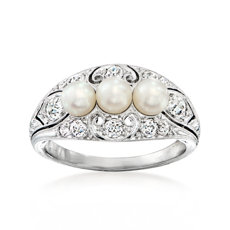 Platinum filigree ring with three cultured pearls and clear diamond accents