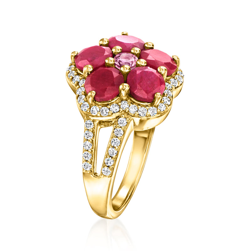 Gold gemstone flower ring with ruby-red and pink center, with clear stones on the band