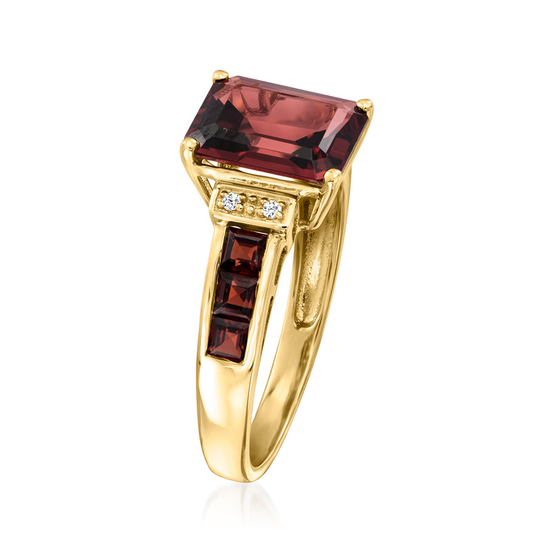 14kt yellow gold ring with large red garnet top and baguette-cut side garnets
