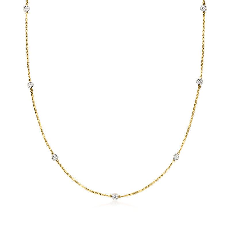 Vintage diamond station necklace in 14kt two-tone gold with small round diamond accents