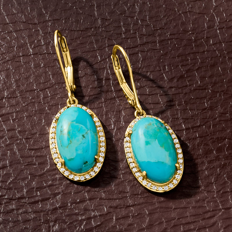 Turquoise oval drop earrings on gold leverback hooks with white stone border
