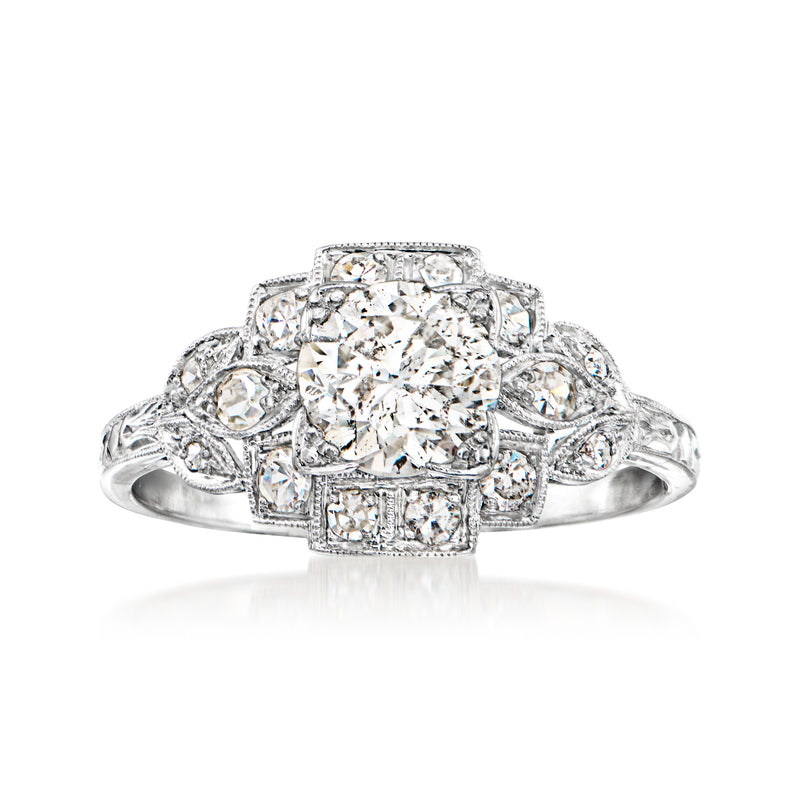 Vintage diamond milgrain ring in platinum with central round stone and side diamonds