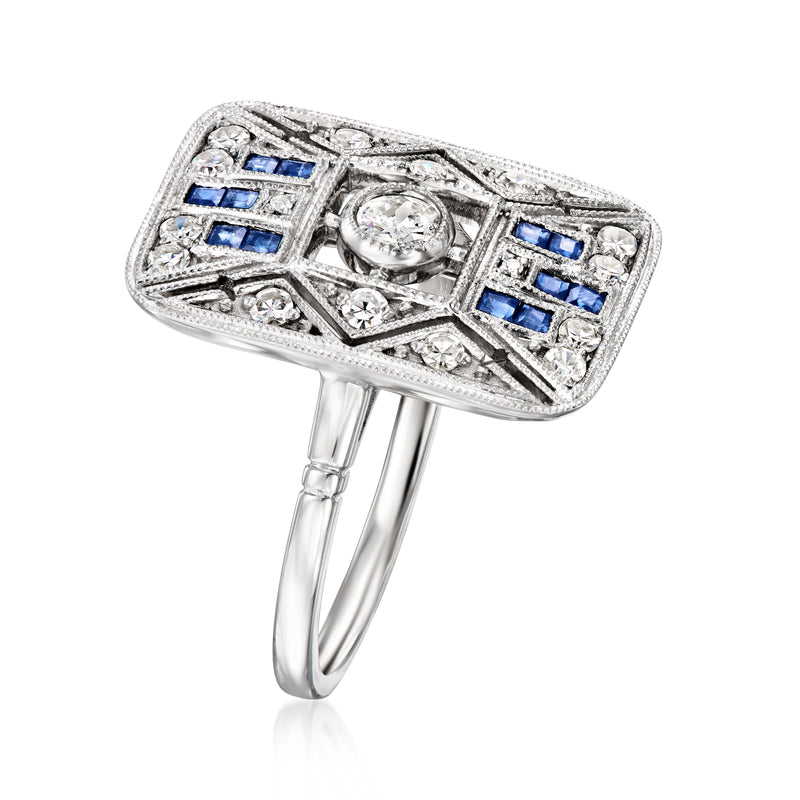Platinum openwork ring side view with blue sapphire and clear diamond clusters in a square frame