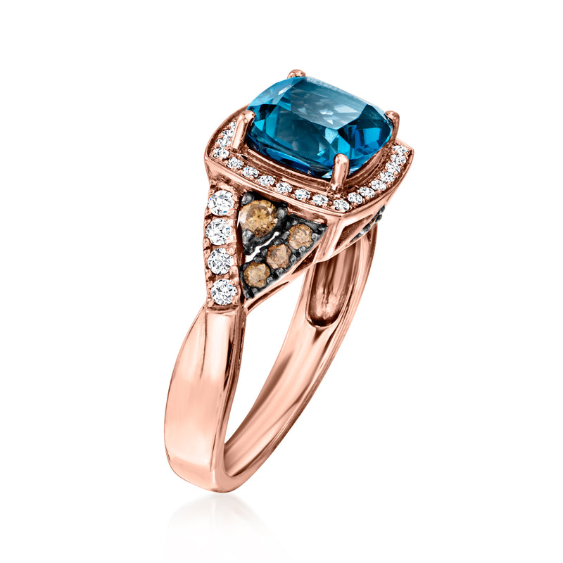 Rose-gold ring with rectangular blue topaz, diamonds on sides, angled view