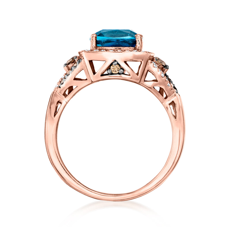 Rose-gold ring side view with blue topaz in openwork setting and diamond accents