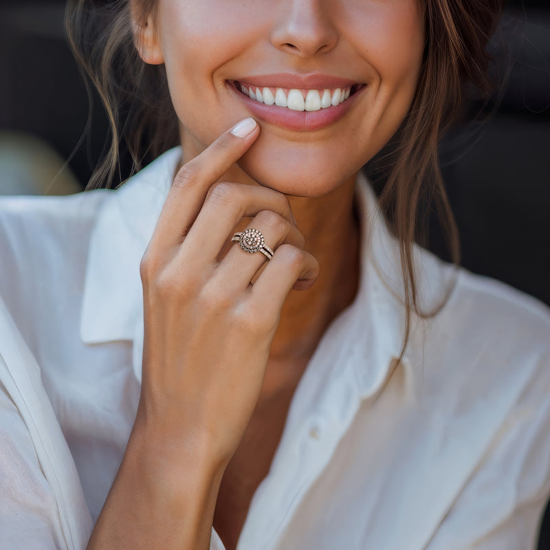 Le Vian diamond ring in strawberry gold with round halo design on a woman's finger