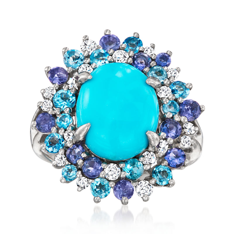 Sterling silver ring with large turquoise oval center and blue multi-gem halo