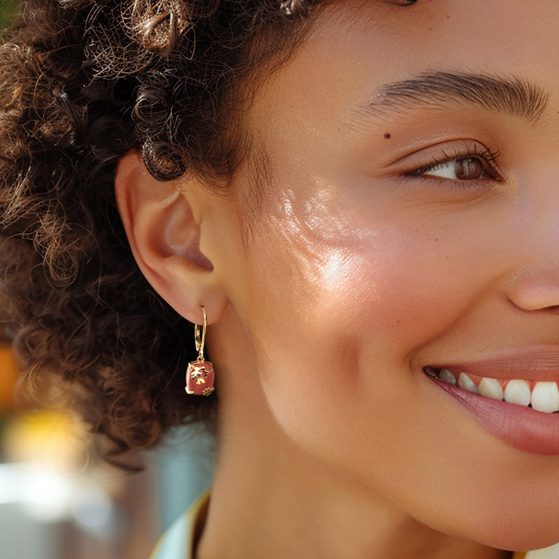 Orange carnelian reef drop earrings with gold leverback worn on ear