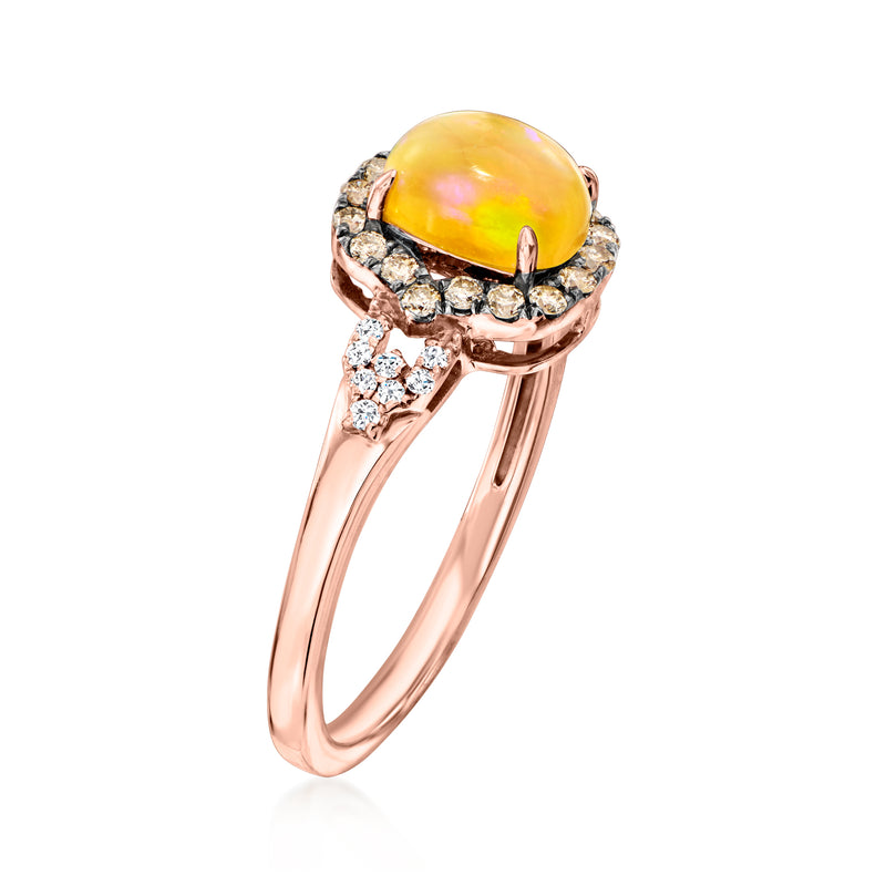 Rose gold oval opal ring, angled view with diamond cluster halo