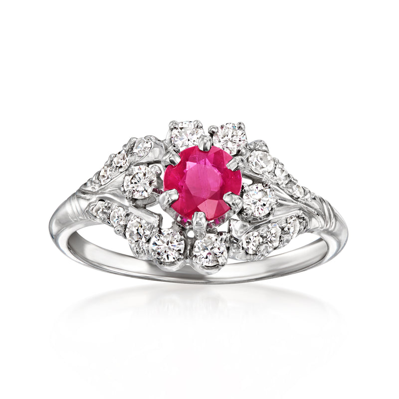 Vintage 18kt white gold ring with round ruby center and diamond halo