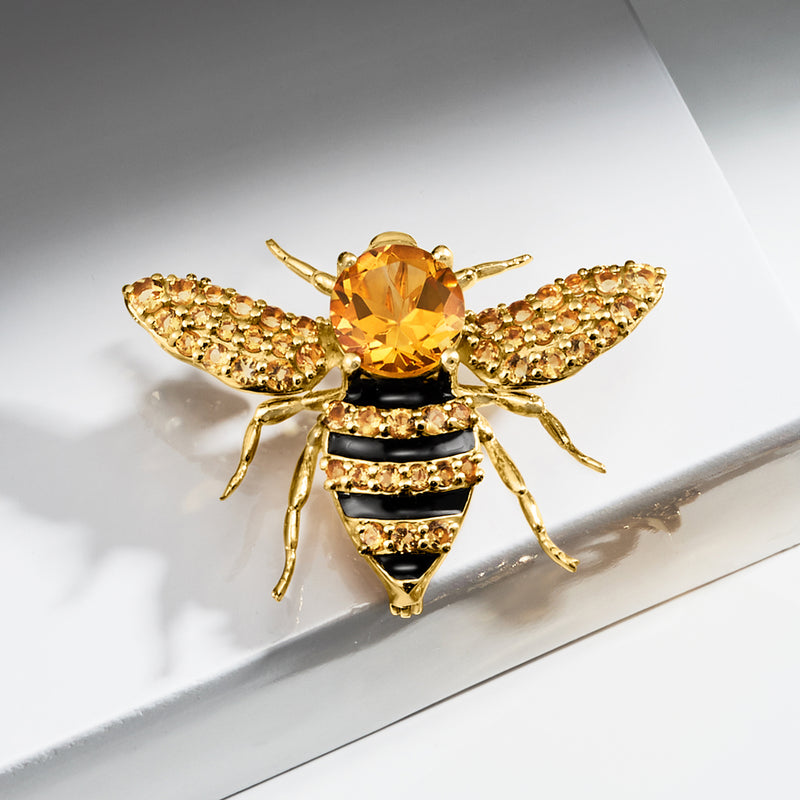 Bee pendant necklace on gold chain with oval citrine gemstone and glittering pave wings