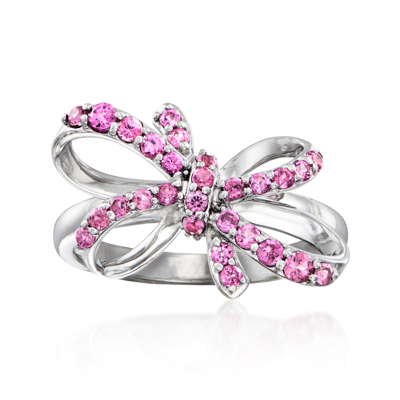 Sterling silver bow ring with pink rhodolite garnet-like stones, prong-set flower center