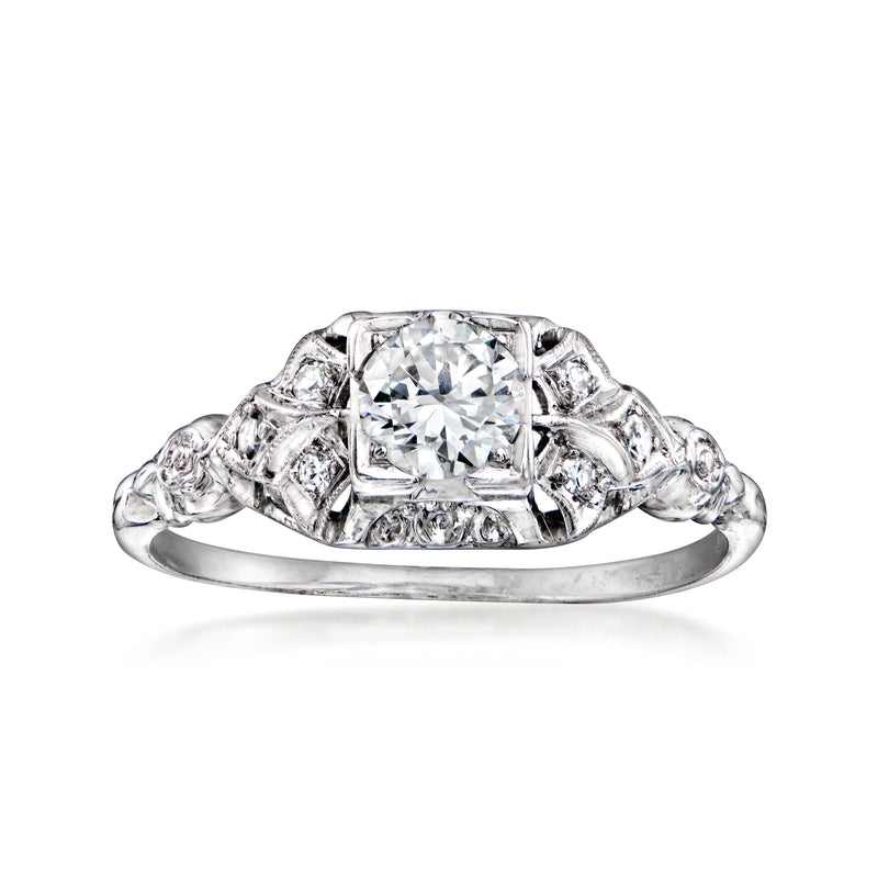 Vintage white gold diamond filigree ring with large center stone and side scrollwork