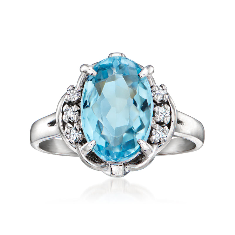 Platinum oval aquamarine ring with diamond side stones, vintage 1990 style