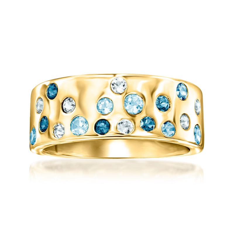 Gold-tone ring with blue and clear gemstones in a wide bezel band